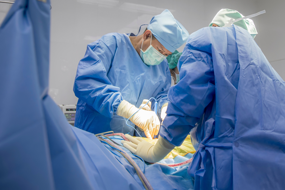 Close up photo of doctor perform surgery inside modern operating